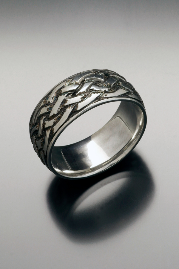 Engraved sterling wedding ring with braid pattern